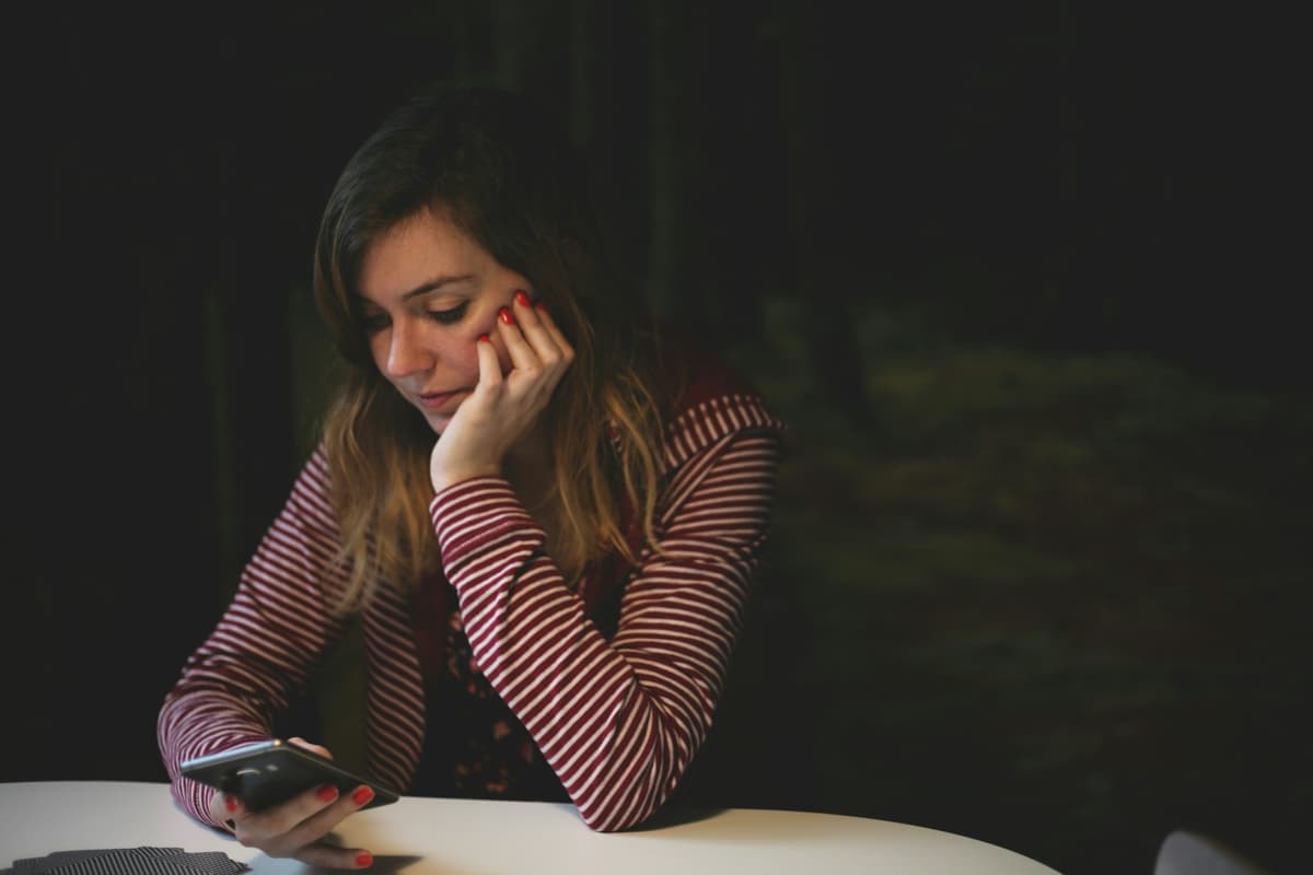 Person contemplating social media interactions